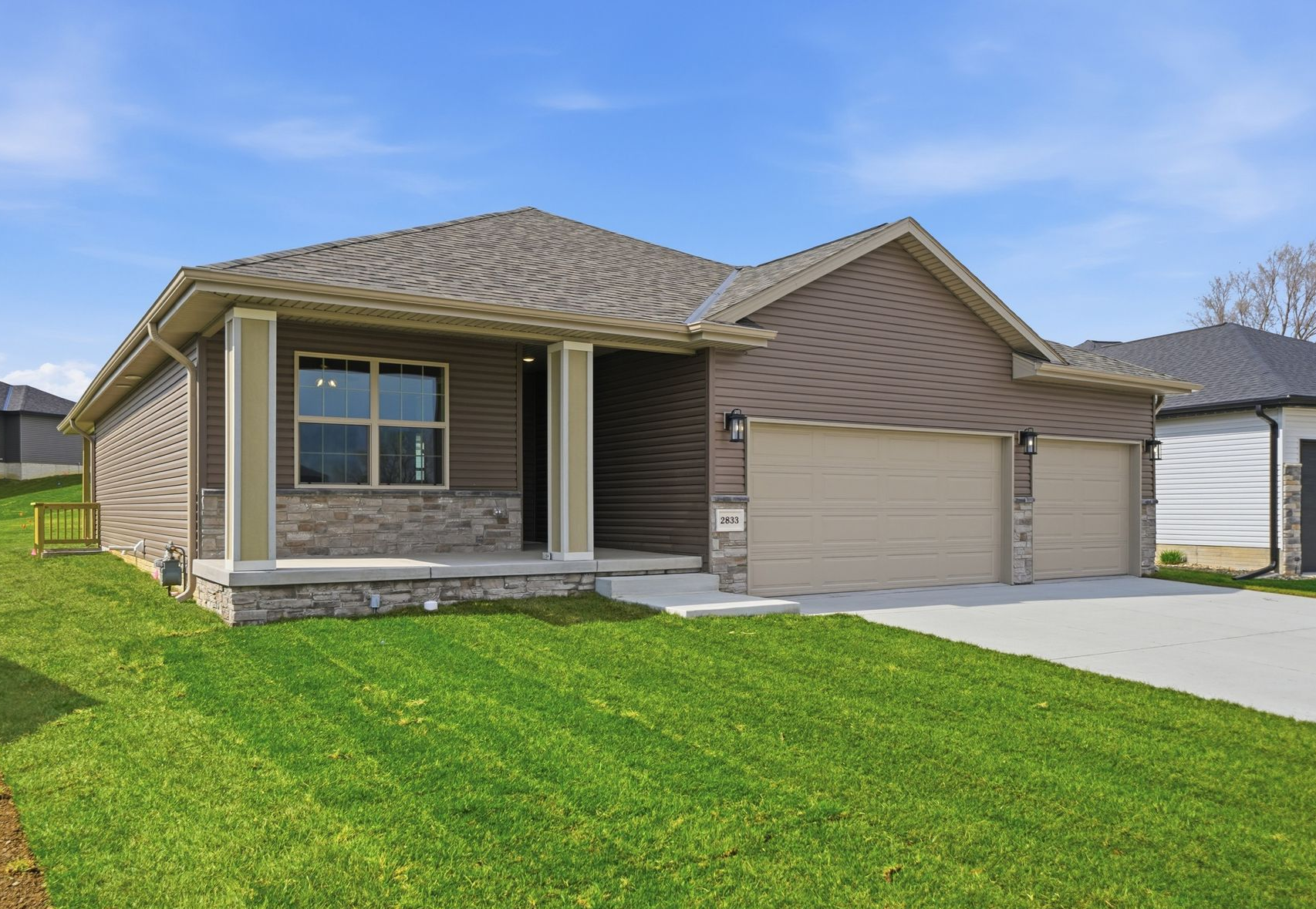 New Prairie Home Builders house with a broad front elevation in Lincoln